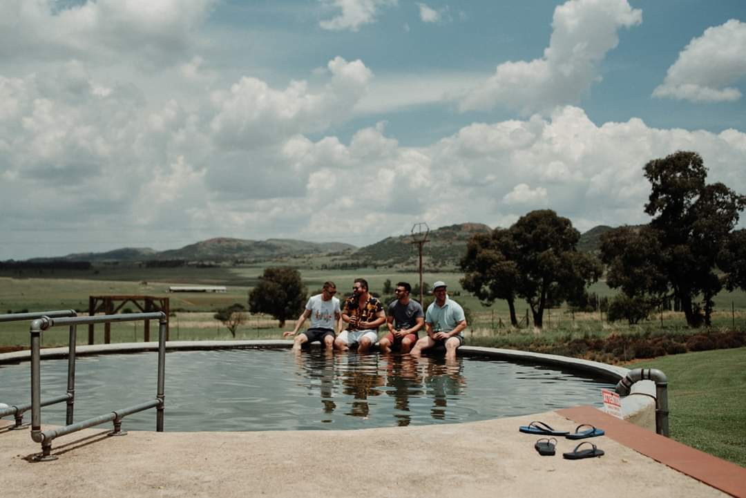 Guests enjoying the pool at The Stone Cellar