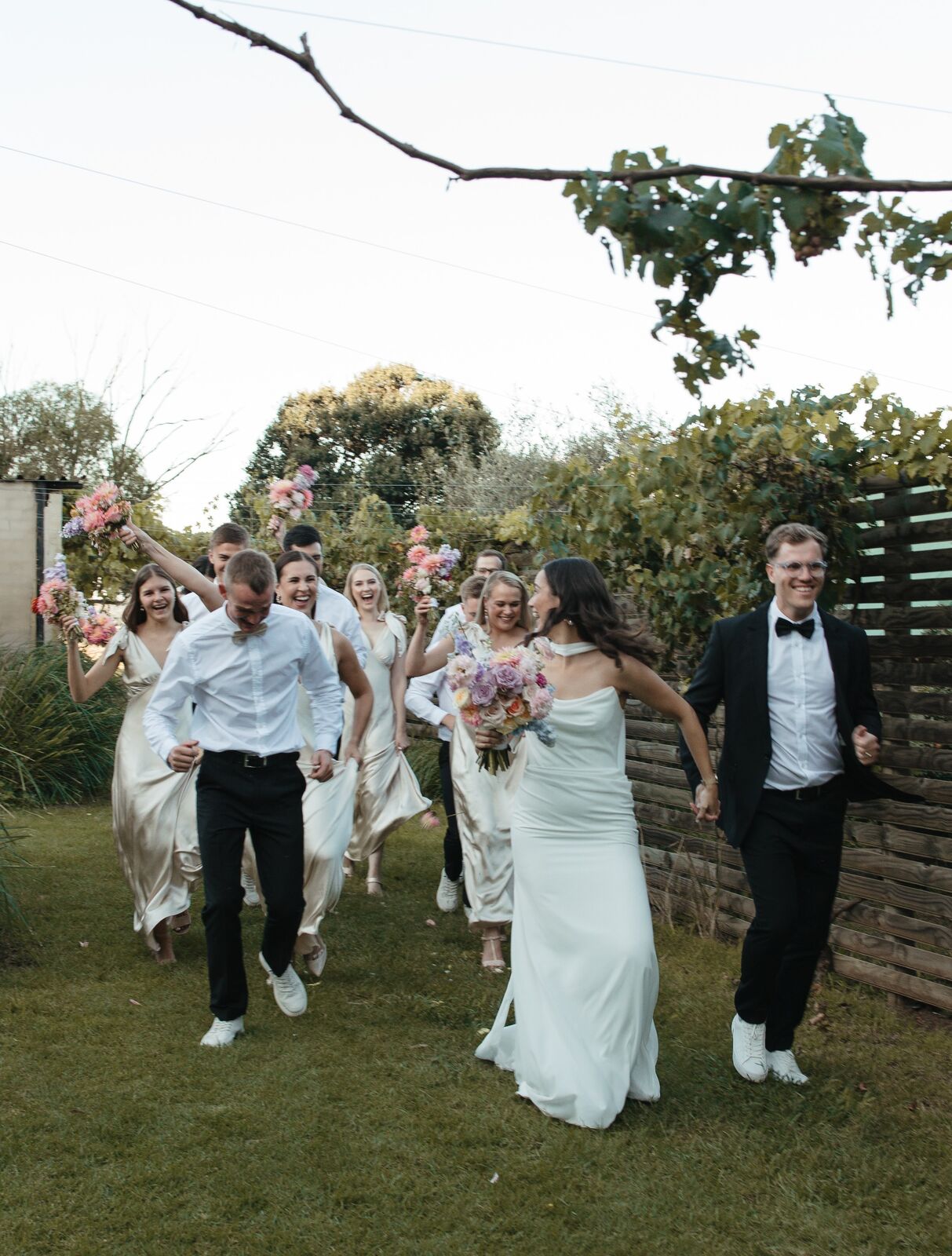 Couple and bridal party celebrating at The Stone Cellar